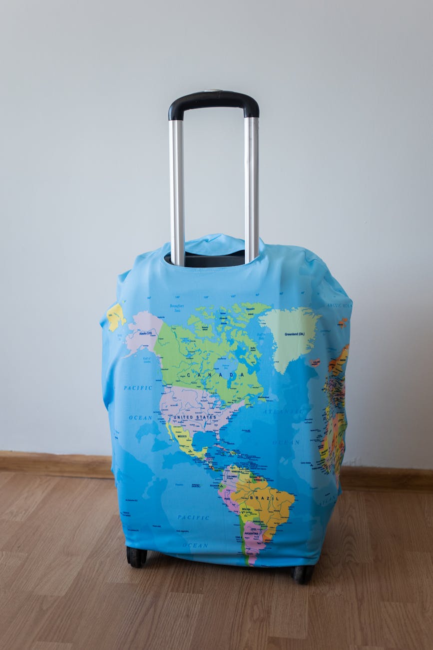 suitcase with world map in room