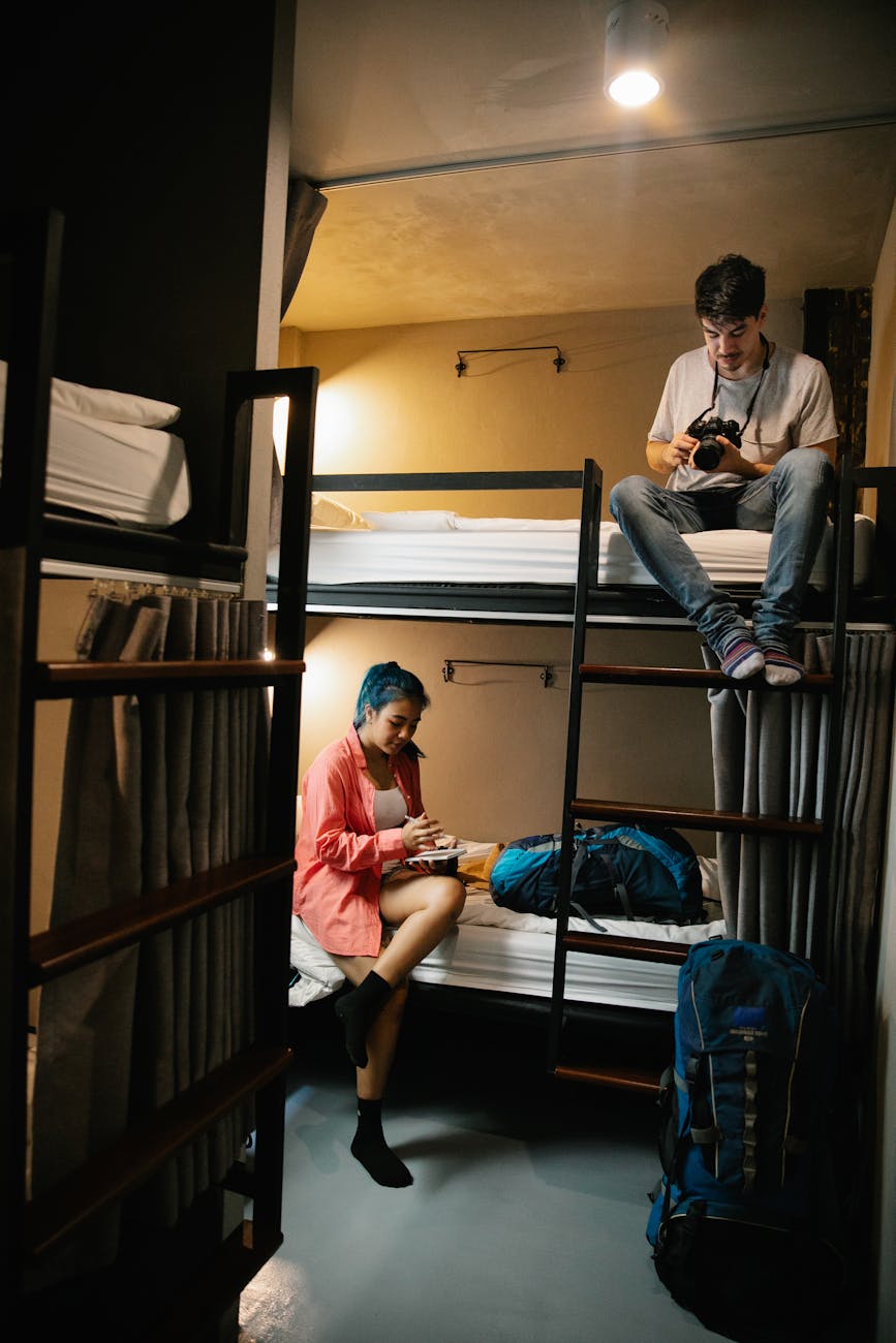 couple of travellers in a hostel room